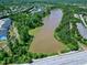 An aerial view of the lake and surrounding greenway of the neighborhood at 1141 Brookhill Way, Cary, NC 27519