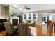 Cozy living room featuring a fireplace and hardwood floors, perfect for relaxing and enjoying time with loved ones at 1141 Brookhill Way, Cary, NC 27519