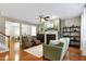 Bright and airy living room with a fireplace, hardwood floors, and stylish furnishings, perfect for relaxing and entertaining at 1141 Brookhill Way, Cary, NC 27519