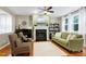 Comfortable living room with hardwood floors and natural light, creating a relaxing space for gatherings and quiet moments at 1141 Brookhill Way, Cary, NC 27519