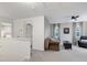 Cozy loft with neutral colors, natural light, seating, and view to bedroom at 1141 Brookhill Way, Cary, NC 27519