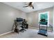 The home office has carpet, neutral walls, and a treadmill for exercise at 1141 Brookhill Way, Cary, NC 27519