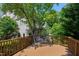 Enjoy this deck with a cozy swing on the beautiful backyard patio overlooking lush greenery at 1141 Brookhill Way, Cary, NC 27519