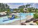 Resort-style community pool with ' splash area, slides, and lighthouse feature at 1141 Brookhill Way, Cary, NC 27519