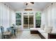 Cozy sunroom featuring a vaulted ceiling, a seating area, and large windows offering abundant natural light at 1141 Brookhill Way, Cary, NC 27519