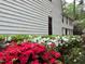 Charming home exterior with colorful azaleas and lush landscaping at 11813 Edgewater Ct, Raleigh, NC 27614