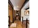 Inviting hallway featuring brick flooring and exposed wooden beams at 11813 Edgewater Ct, Raleigh, NC 27614