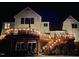 Backyard deck with wooden steps and string lights at 11813 Edgewater Ct, Raleigh, NC 27614