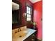Cozy bathroom features a classic vanity, decorative lighting, and a window that fills the space with natural light at 11813 Edgewater Ct, Raleigh, NC 27614