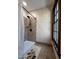 Bathroom featuring a shower, tiled wall, neutral walls, and a window at 11813 Edgewater Ct, Raleigh, NC 27614