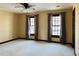 Spacious bedroom featuring plush carpeting, neutral walls, natural lighting, and a modern ceiling fan at 11813 Edgewater Ct, Raleigh, NC 27614