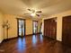 Spacious bedroom with hardwood floors, multiple windows, and a ceiling fan at 11813 Edgewater Ct, Raleigh, NC 27614