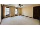 Spacious bedroom featuring plush carpeting, neutral walls, natural lighting, and two windows at 11813 Edgewater Ct, Raleigh, NC 27614