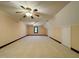 Bonus room featuring two ceiling fans, carpet, and natural light from a window at 11813 Edgewater Ct, Raleigh, NC 27614
