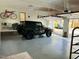 Spacious garage interior with car and storage at 11813 Edgewater Ct, Raleigh, NC 27614