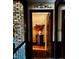 Hallway featuring a brick wall accent and a wood floor at 11813 Edgewater Ct, Raleigh, NC 27614