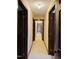 Hallway with wood trim and doors and neutral colored walls and plush carpet at 11813 Edgewater Ct, Raleigh, NC 27614