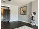 Living room featuring gray walls, dark laminate flooring, and a telescope at 11813 Edgewater Ct, Raleigh, NC 27614
