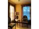Cozy living room featuring decorative chairs, sheer curtains, and a stylish lamp on an accent table at 11813 Edgewater Ct, Raleigh, NC 27614