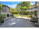 An outdoor stone fireplace and brick patio with a table and chairs offer outdoor relaxation and entertainment space at 1225 Fanning Dr, Wake Forest, NC 27587