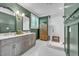 Elegant bathroom with a marble countertop, a double vanity, and a frameless glass shower at 1225 Fanning Dr, Wake Forest, NC 27587