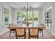 Bright dining room with a view of the outdoor fireplace and ample natural light at 1225 Fanning Dr, Wake Forest, NC 27587