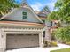 Craftsman home with a two-car garage, stone accents and professionally landscaped front yard at 1225 Fanning Dr, Wake Forest, NC 27587