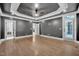 Spacious main bedroom with tray ceilings, hardwood floors, and a private entry to the backyard at 1225 Fanning Dr, Wake Forest, NC 27587
