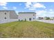Lush backyard features a white picket fence, grassy lawn, and patio perfect for outdoor enjoyment at 1303 Bent Willow Dr, Durham, NC 27704