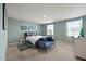 Bright bedroom with ample natural light from two windows and neutral carpeting at 1303 Bent Willow Dr, Durham, NC 27704