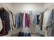 Walk-in closet offers ample storage space with shelving and rod for hanging clothes at 1303 Bent Willow Dr, Durham, NC 27704