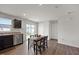 Cozy dining area with a table for four, next to a kitchen at 1303 Bent Willow Dr, Durham, NC 27704