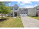 Charming two-story home with a well-manicured lawn and attached two-car garage at 1303 Bent Willow Dr, Durham, NC 27704
