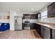 Modern kitchen with stainless steel appliances and dark wood cabinets at 1303 Bent Willow Dr, Durham, NC 27704