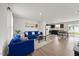 Bright, open-concept living area with hardwood floors, modern furniture, and natural light at 1303 Bent Willow Dr, Durham, NC 27704