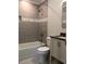 Updated bathroom with a tiled shower, modern fixtures, and vanity at 157 Thorpe St, Henderson, NC 27536