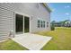 Home backyard with a sliding glass door, a concrete patio, and lawn at 1730 Pie Filling Dr, Haw River, NC 27258