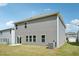 Rear view of a home showing the siding, concrete patio, and lawn at 1730 Pie Filling Dr, Haw River, NC 27258