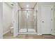 Modern bathroom featuring a glass-enclosed shower with neutral tile and a walk-in design at 1730 Pie Filling Dr, Haw River, NC 27258