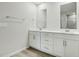 Bright bathroom with double vanity, white cabinets, and modern fixtures at 1730 Pie Filling Dr, Haw River, NC 27258