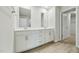 Bright bathroom featuring dual sinks, neutral walls, and recessed lighting at 1730 Pie Filling Dr, Haw River, NC 27258