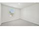 Bright bedroom with neutral walls, carpet, and a window at 1730 Pie Filling Dr, Haw River, NC 27258