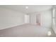 Spacious bedroom with neutral carpet, white walls, and ample natural light from the window at 1730 Pie Filling Dr, Haw River, NC 27258