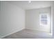 This is a simple bedroom with a single window that offers a view of the outdoors at 1730 Pie Filling Dr, Haw River, NC 27258