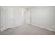 Bedroom features neutral walls, carpet, and doorways at 1730 Pie Filling Dr, Haw River, NC 27258