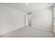 A neutral-toned bedroom featuring plush carpet and a view to the home's hallway and other rooms at 1730 Pie Filling Dr, Haw River, NC 27258