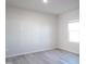 Cozy bedroom featuring neutral walls, modern flooring, and a large window at 1730 Pie Filling Dr, Haw River, NC 27258