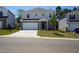 Charming two-story home with gray siding, a two-car garage, and well-manicured lawn at 1730 Pie Filling Dr, Haw River, NC 27258