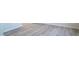 Close-up of modern wood-look flooring with white trim at 1730 Pie Filling Dr, Haw River, NC 27258