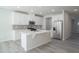 Modern kitchen with white cabinets, stainless steel appliances, and a center island at 1730 Pie Filling Dr, Haw River, NC 27258
